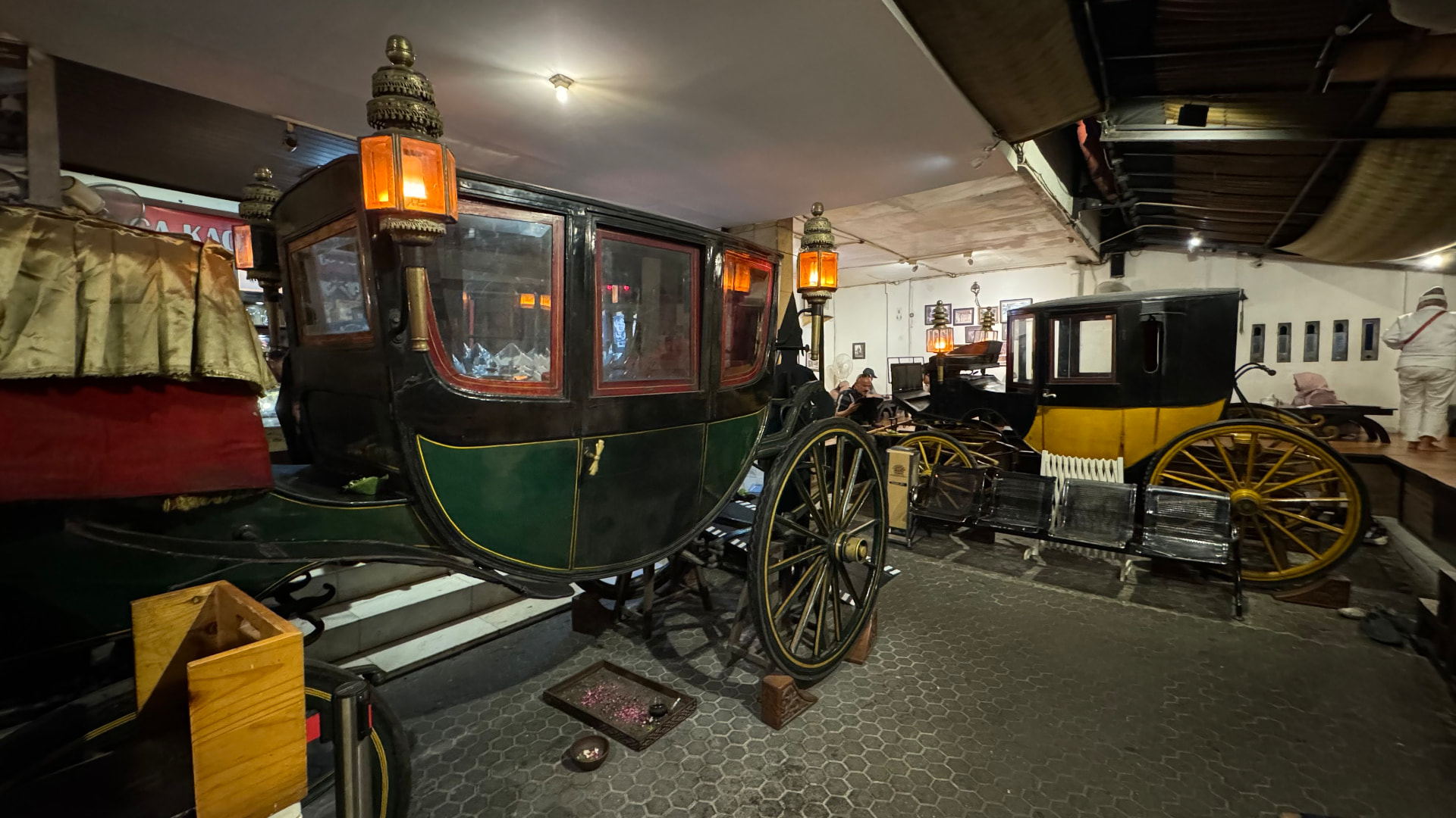 Traditional carriages displayed at the House of Raminten