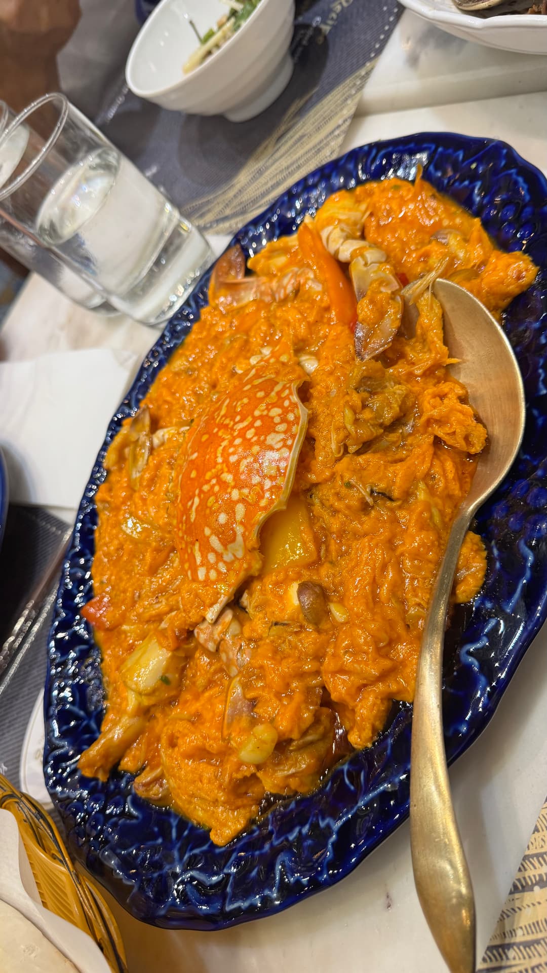 Crab in a rich orange curry sauce