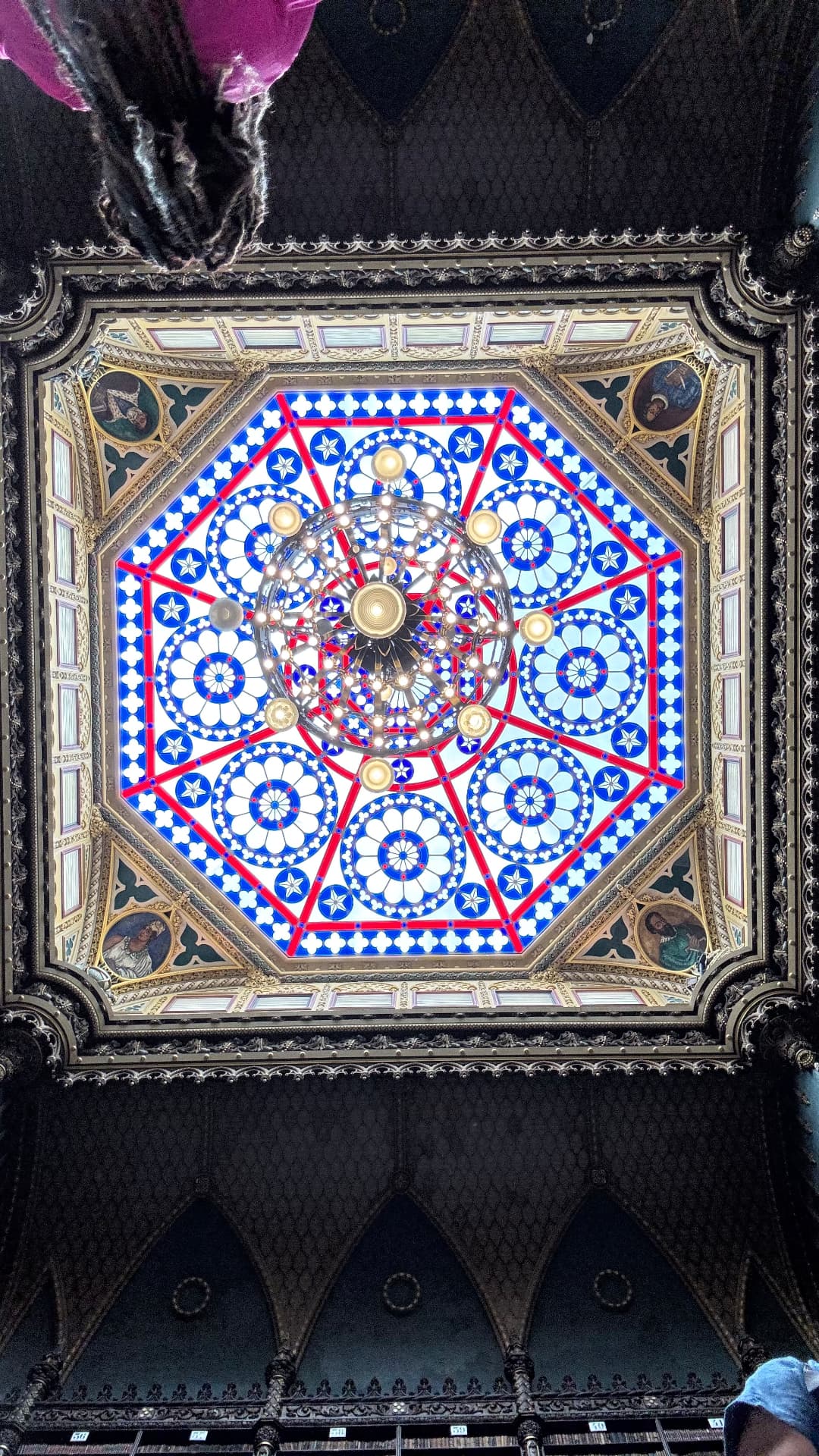 Octagonal stained-glass ceiling and chandelier in the Portuguese Reading Room