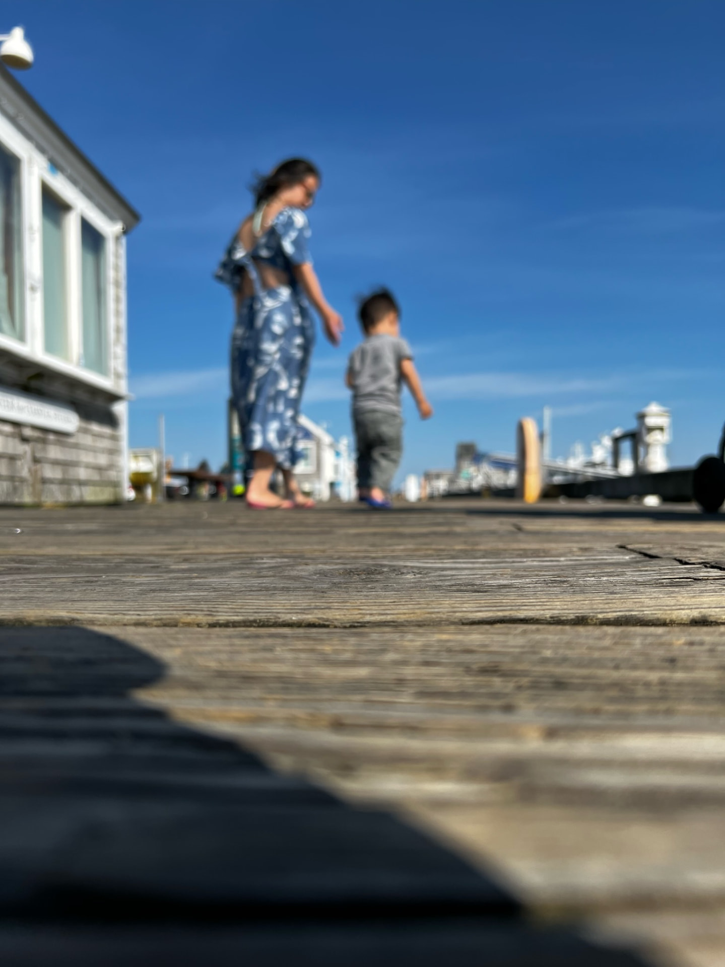 Mother and child walking along the boardwalk