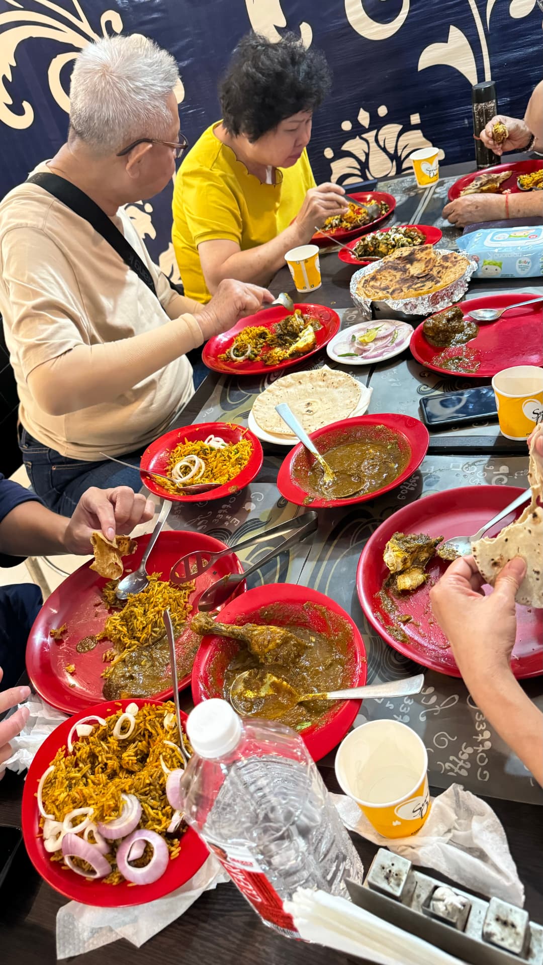 Sharing a colourful spread of dishes around the table. — Kushinagar, Uttar Pradesh, India.