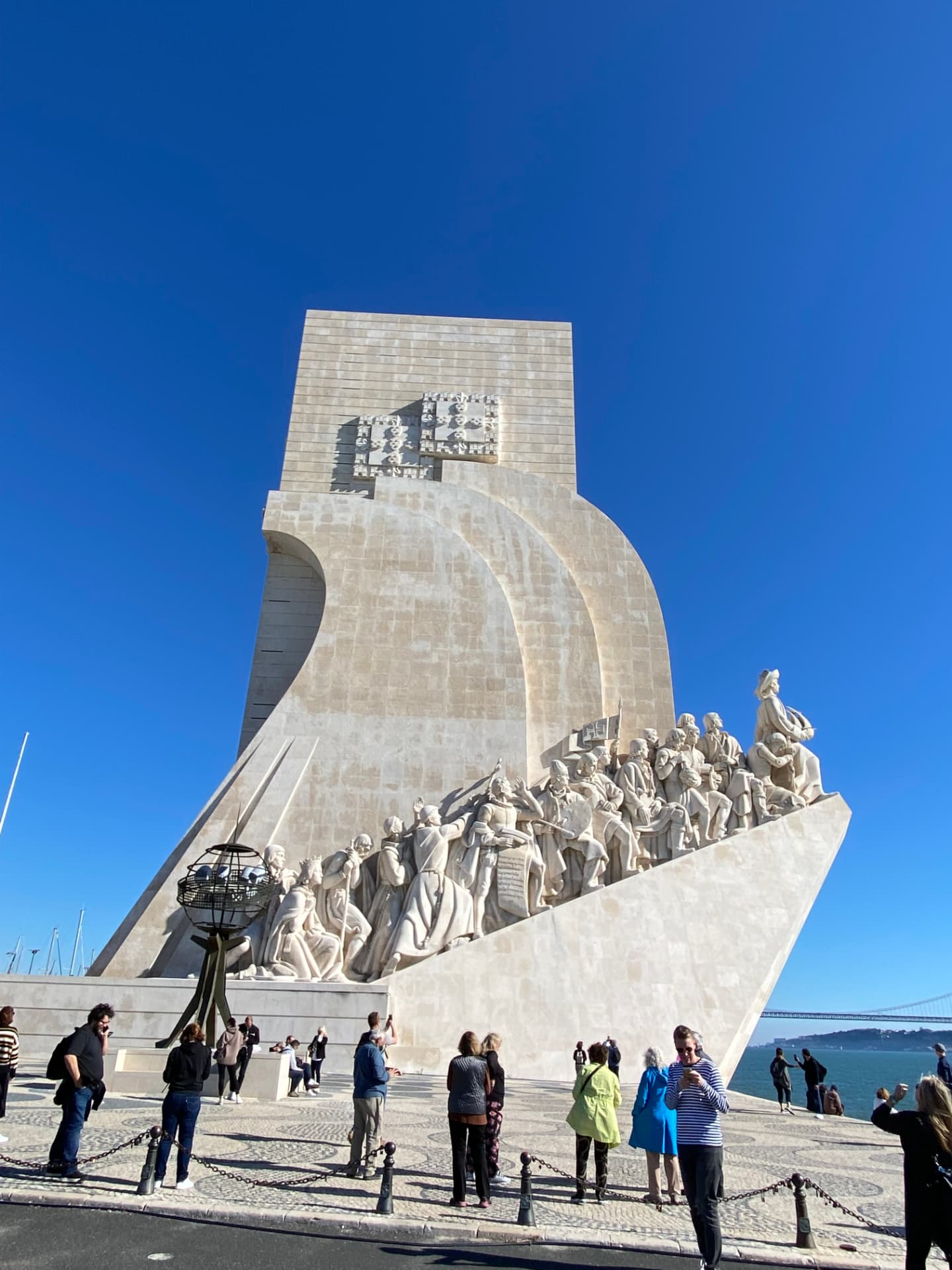 The Monument to the Discoveries against a deep blue sky