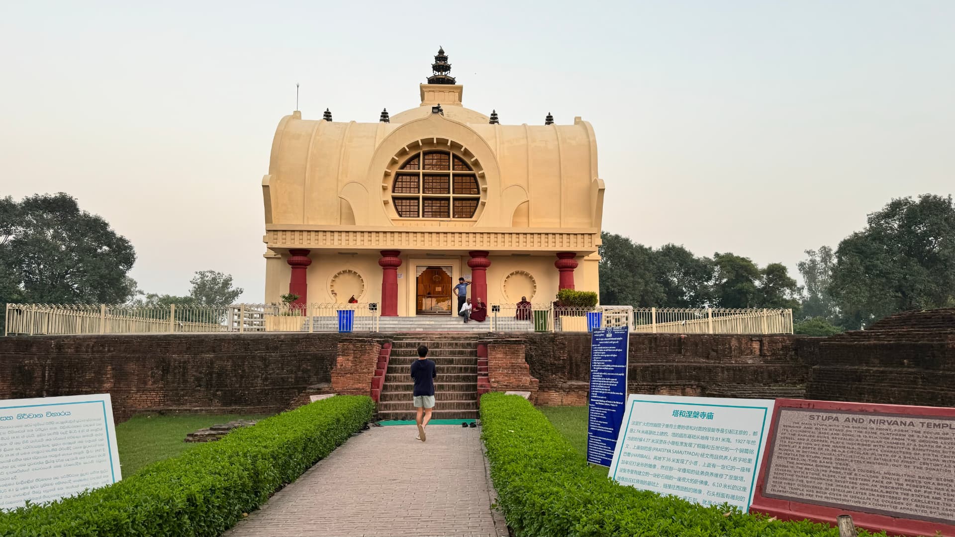 The path leading toward the pale façade of the Nirvana Temple. — Kushinagar, Uttar Pradesh, India.