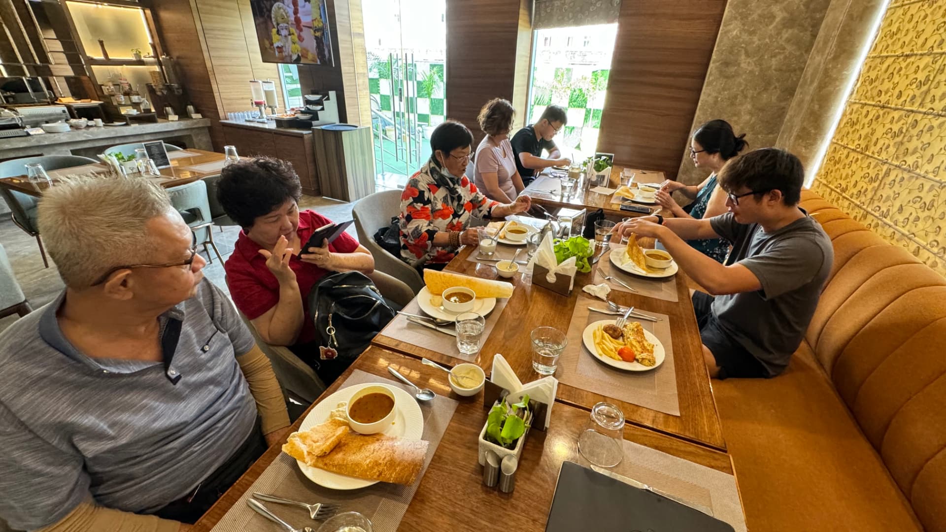 Our group enjoys a meal together before the next visit. — Varanasi, Uttar Pradesh, India.