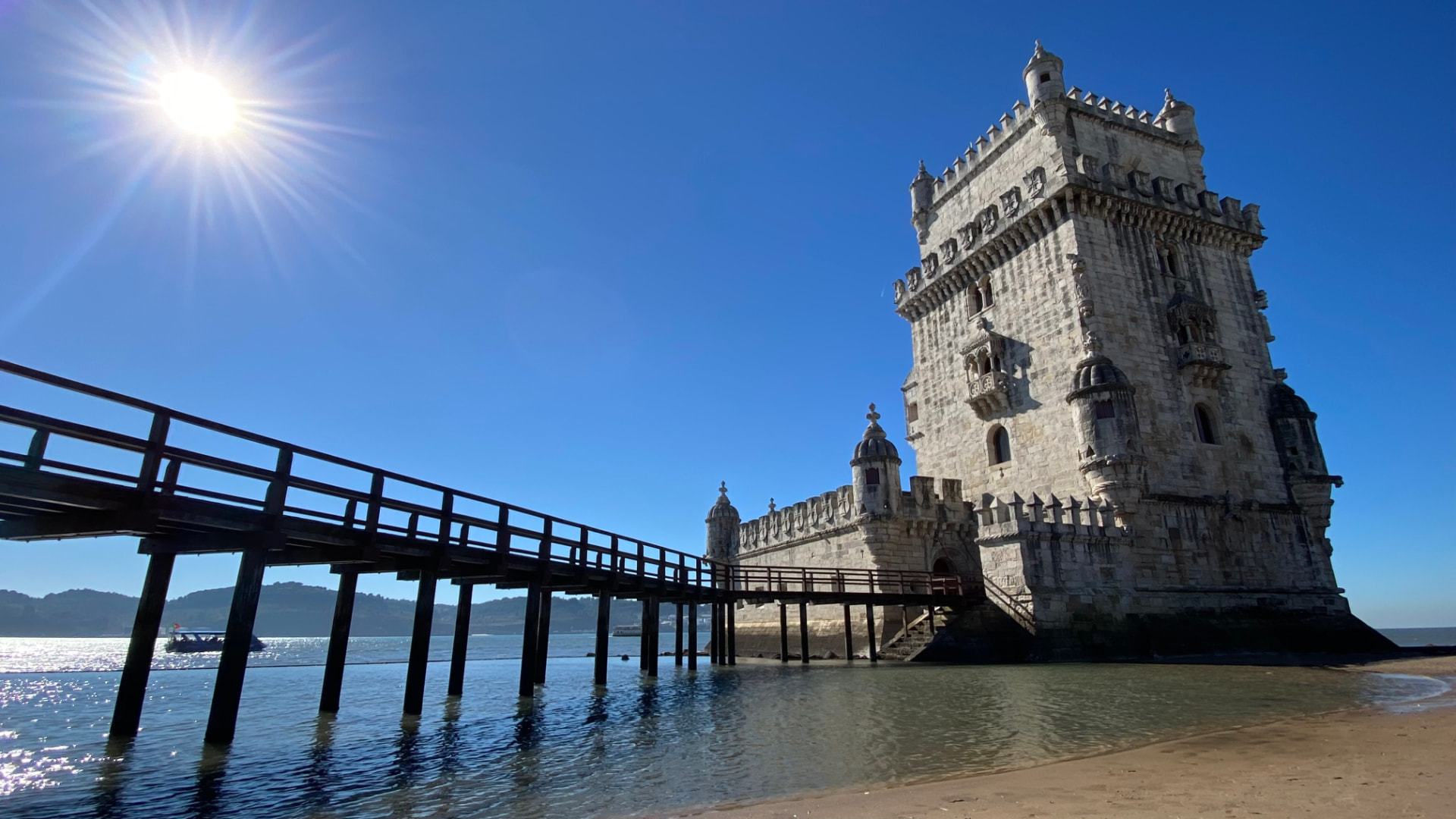Belém Tower beside the Tagus River in bright morning sun