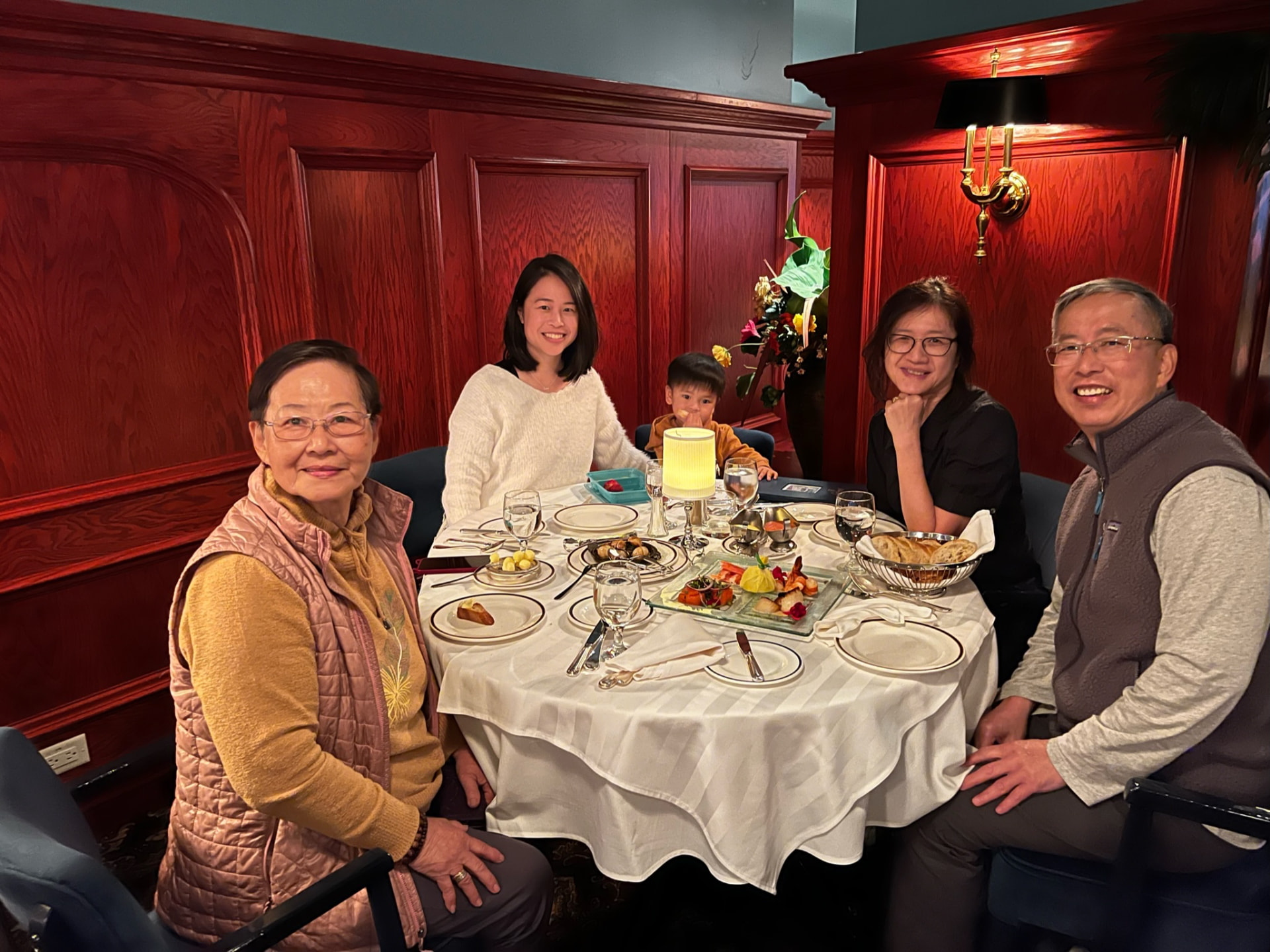 Family gathered around the dinner table at Le Continental