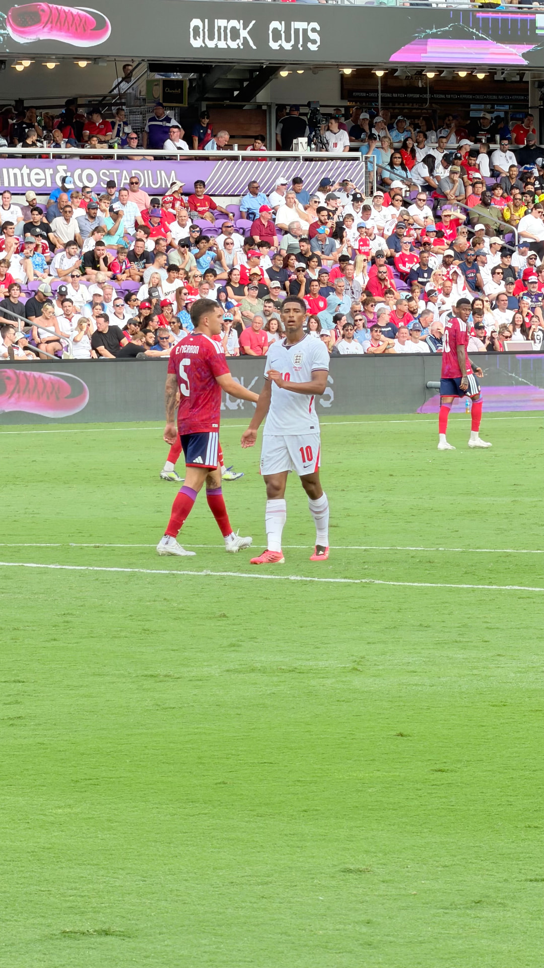 England number ten speaking with an opposing player during the match