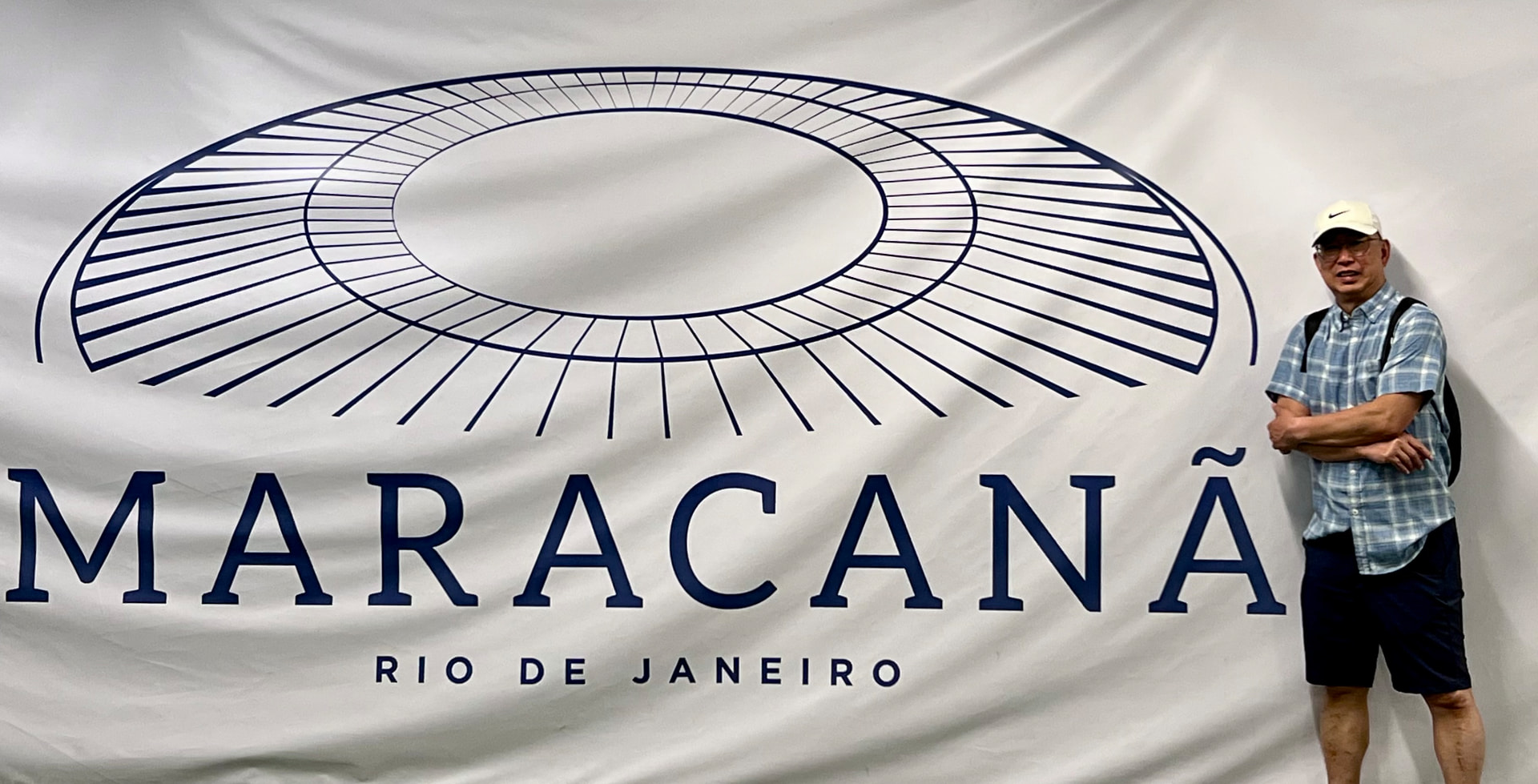 Ken standing beside the large Maracanã Rio de Janeiro emblem