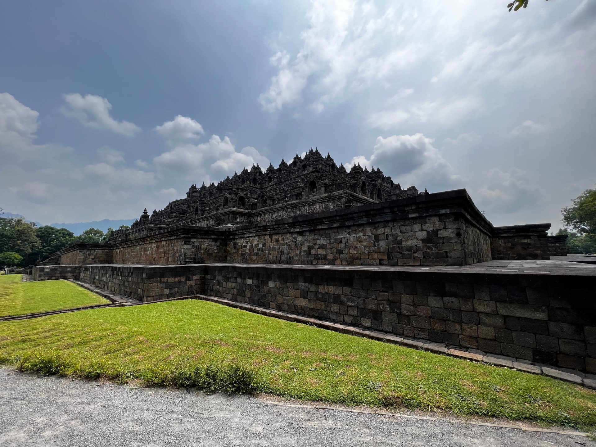 A wide view of the temple's stone terraces under the sky