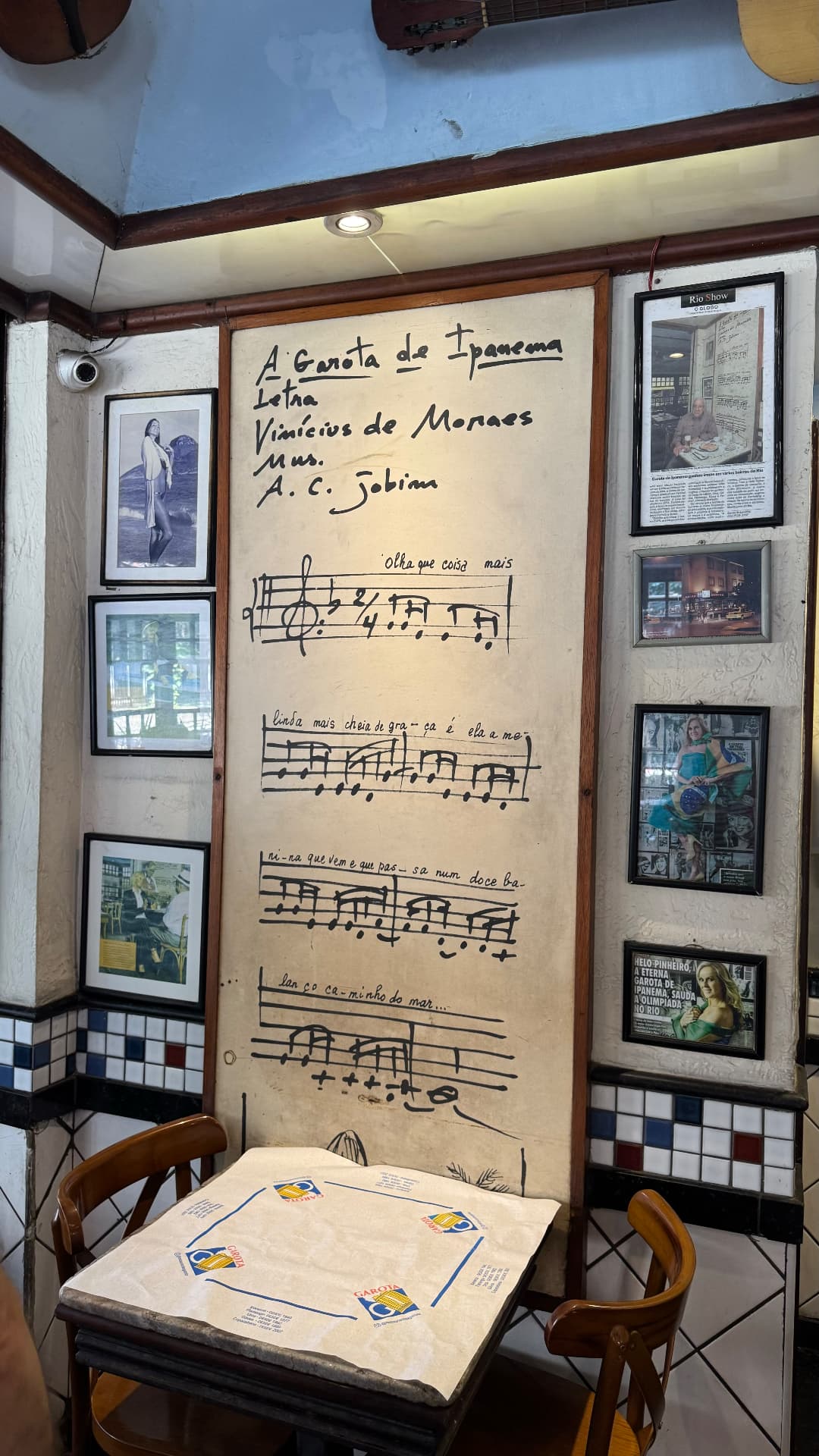 Handwritten lyrics and musical notation for The Girl from Ipanema displayed in the restaurant