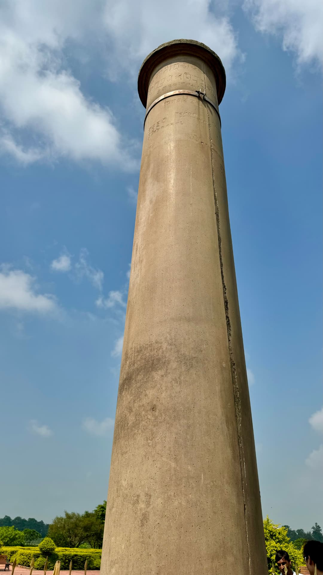 Looking up the weathered stone shaft of the Ashoka pillar. — Lumbini, Nepal.