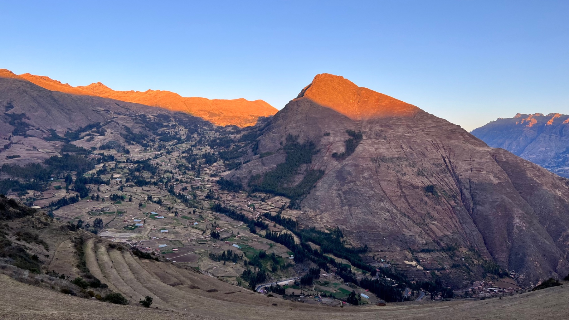 Warm sunset illuminating mountain peaks above the Sacred Valley