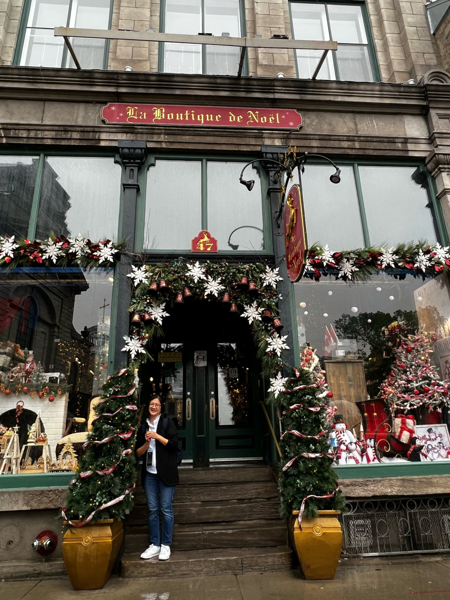 Woman outside the Christmas boutique in Québec City