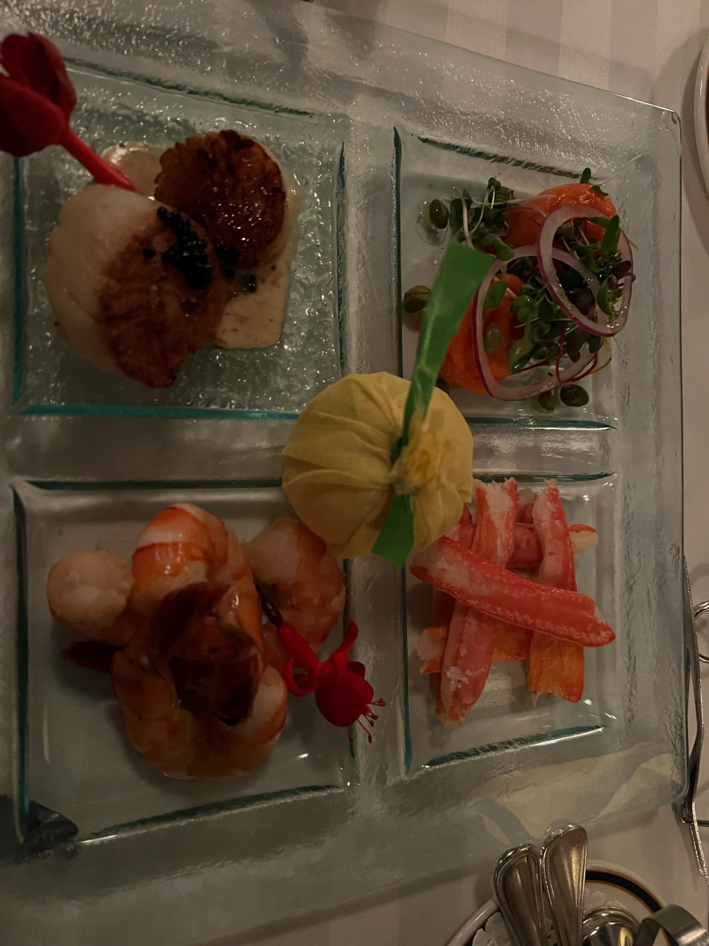Seafood appetizers arranged on a glass platter