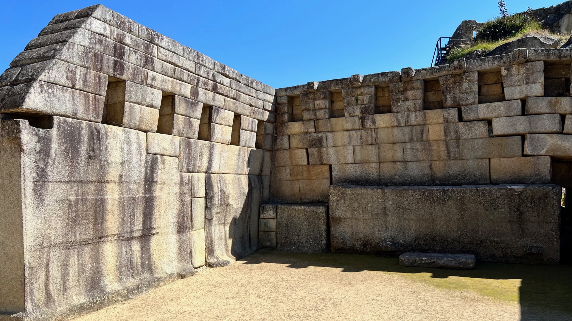 Temple walls made from precisely fitted monumental stone blocks at Machu Picchu