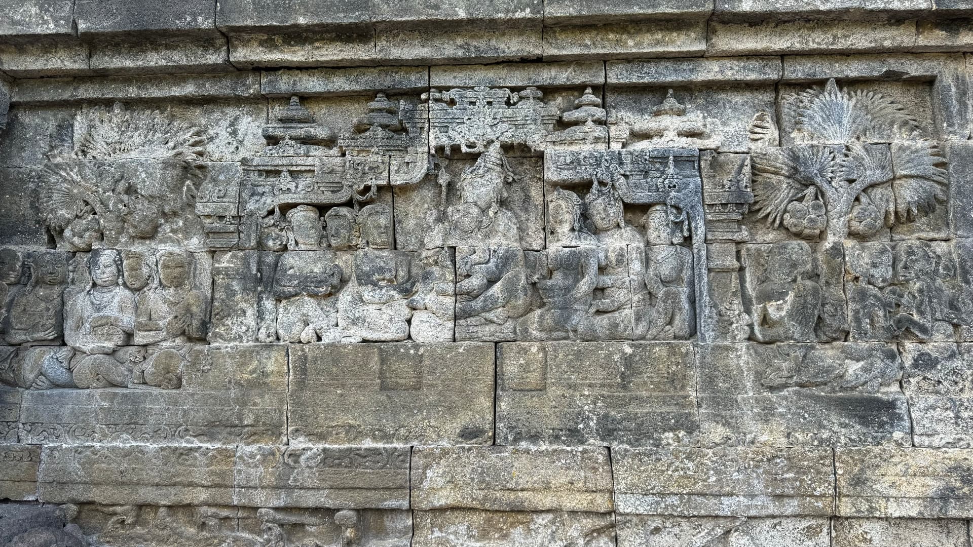 A detailed panel of carved figures and architecture