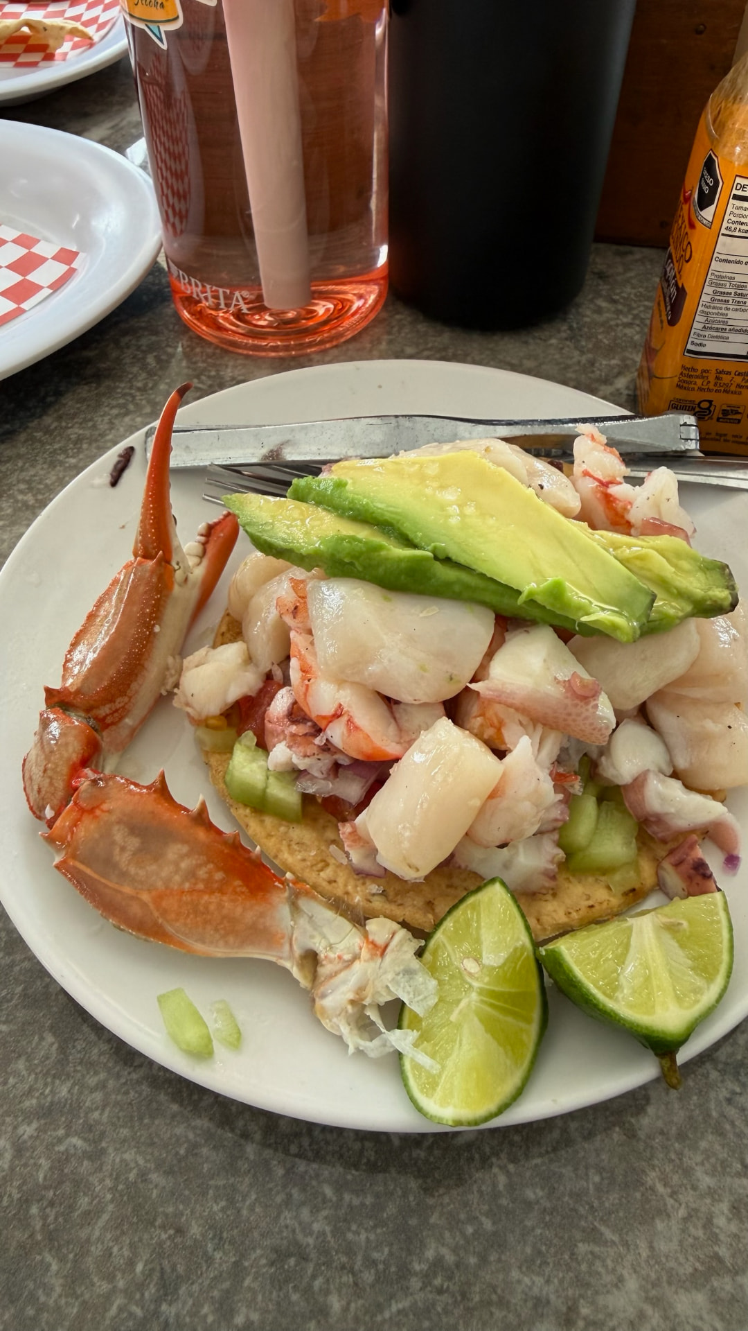 Seafood tostada with crab, scallops, avocado, and lime