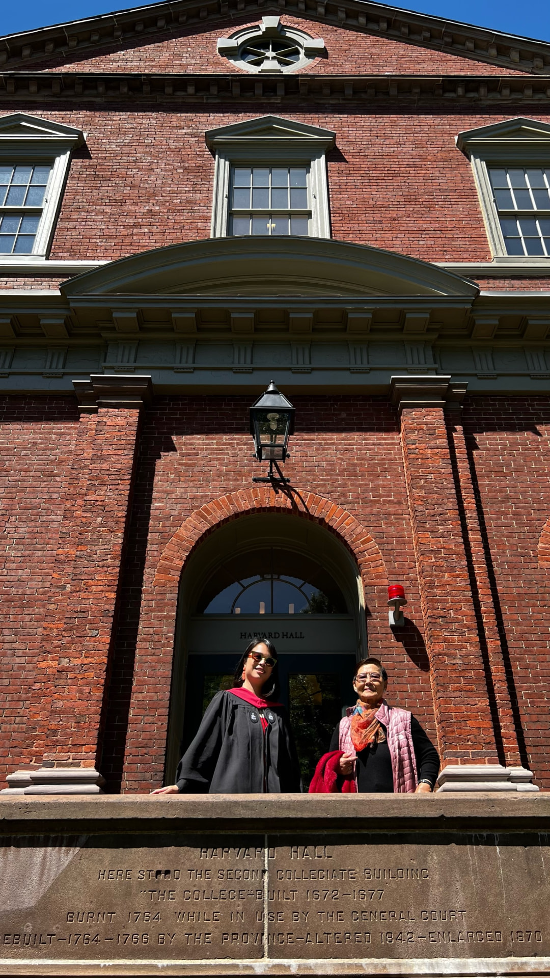 Jocelyn and her mother at the Harvard Hall doorway