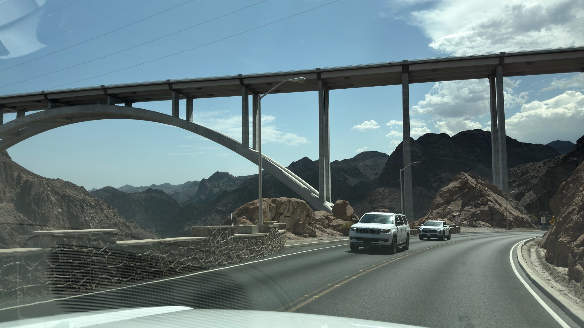 The Hoover Dam bypass bridge arching over the highway