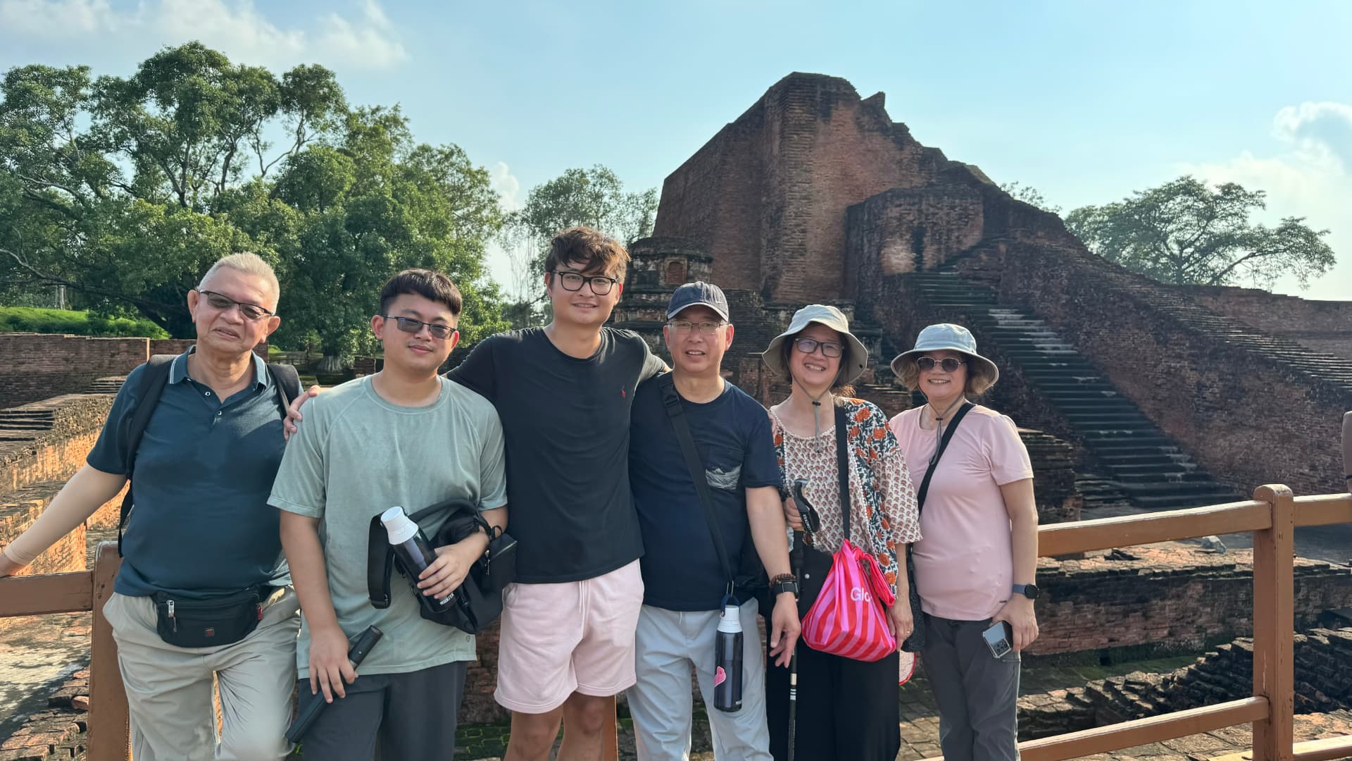 Our group poses beside the monumental brick ruins at Nalanda. — Nalanda, Bihar, India · Patna chapter.