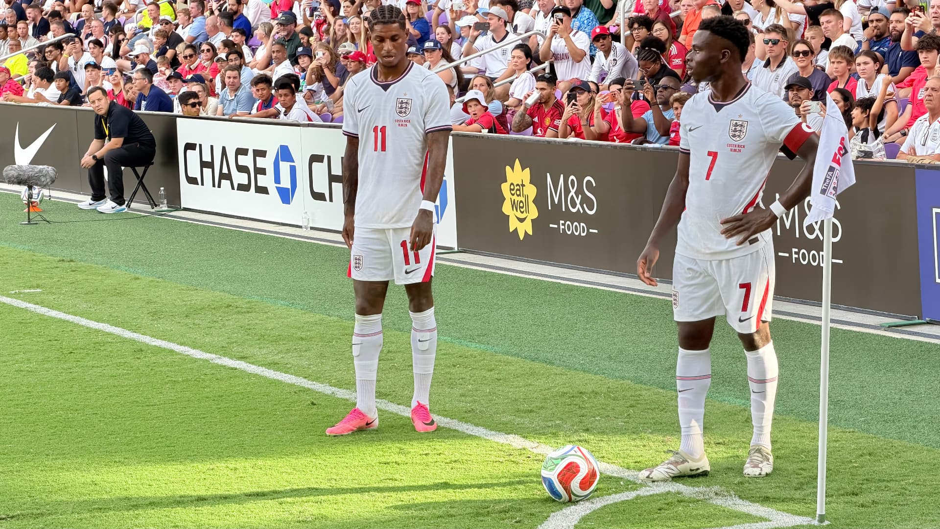 Two England players preparing to take a corner