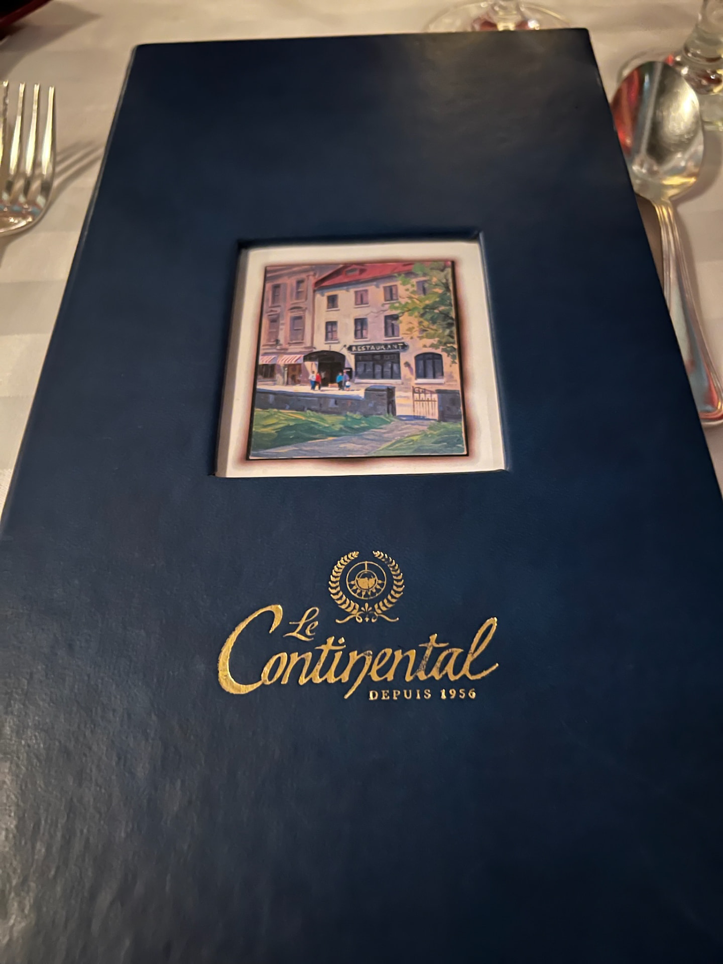 Le Continental restaurant menu on a white tablecloth