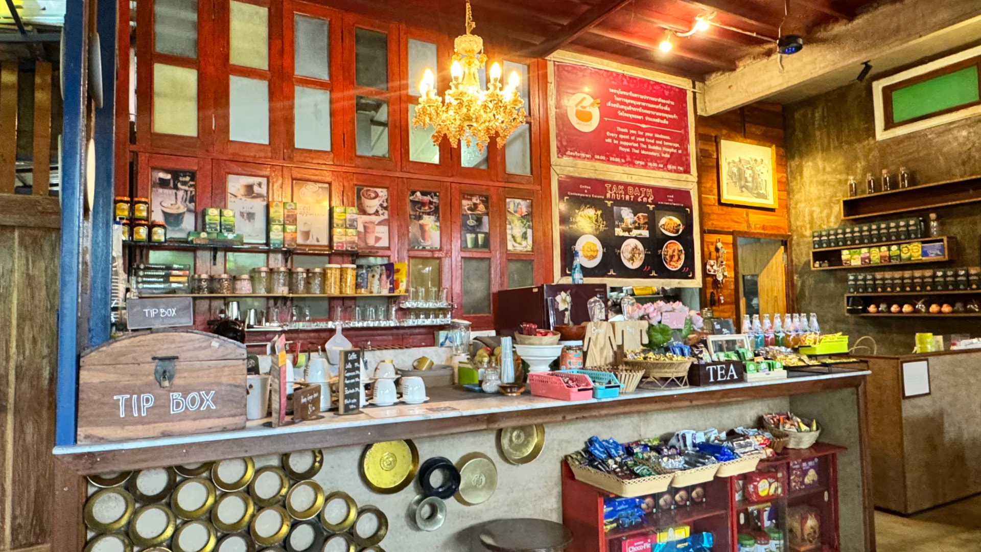 Clocks, framed images and religious objects fill a small shop interior. — Bodh Gaya, Bihar, India.