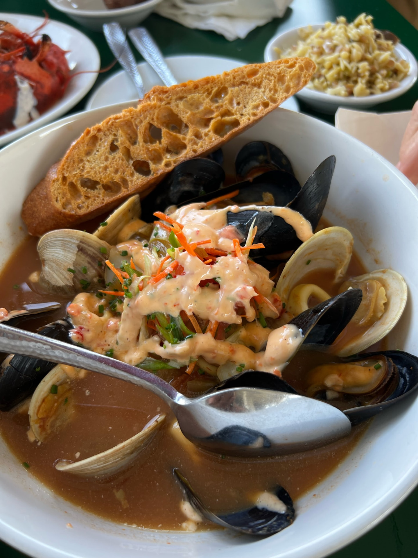 Bowl of mussels and clams with toasted bread