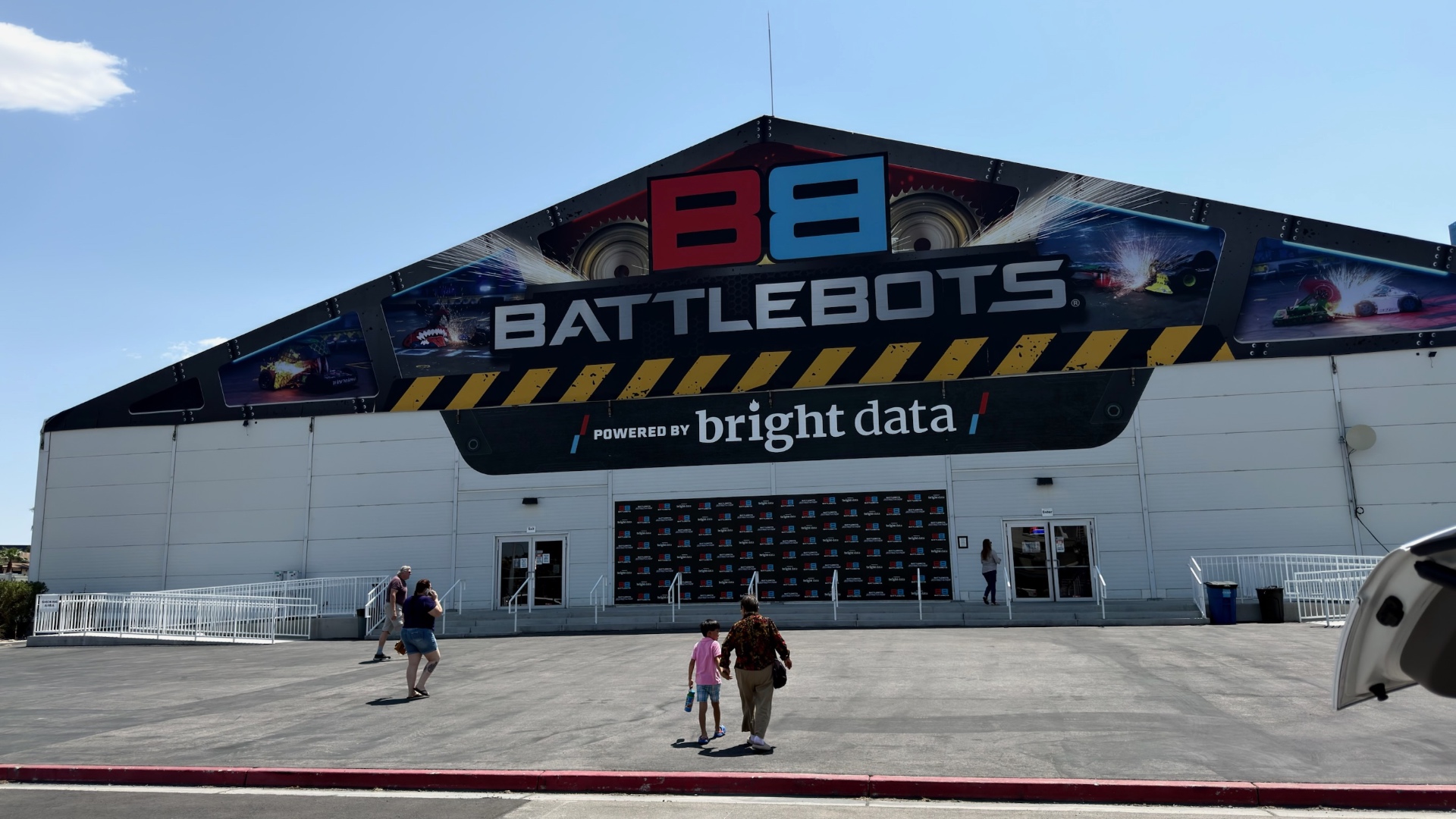 The BattleBots arena building under a blue sky