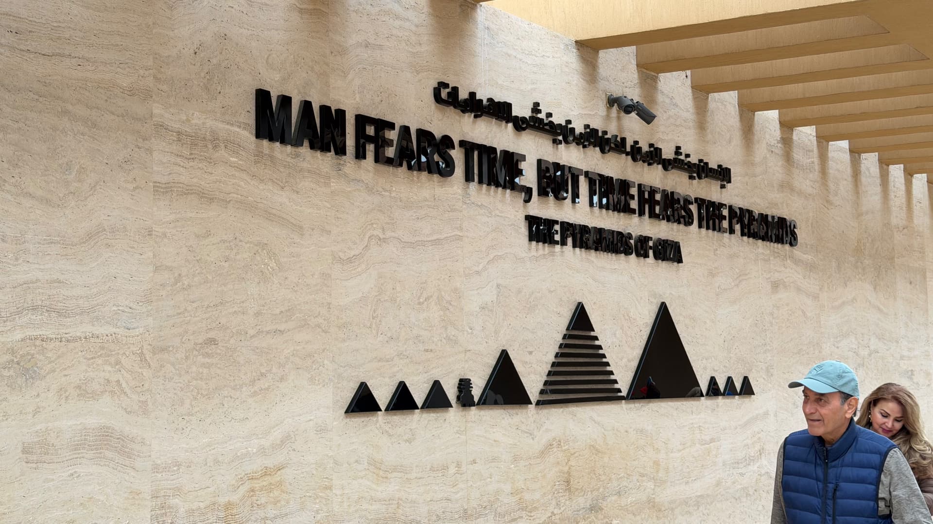 A wall inscription reading Man fears time, but time fears the pyramids