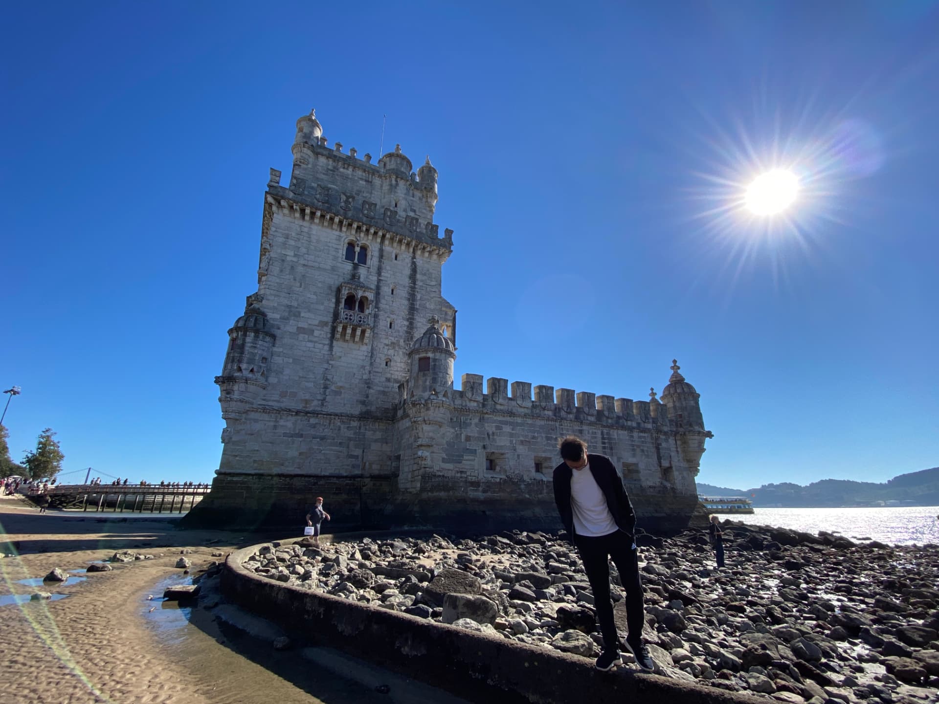 Belém Tower seen from below against a cloudless sky