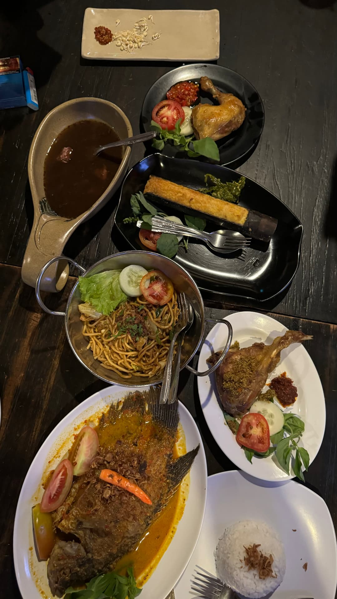 Indonesian dishes spread across a dinner table