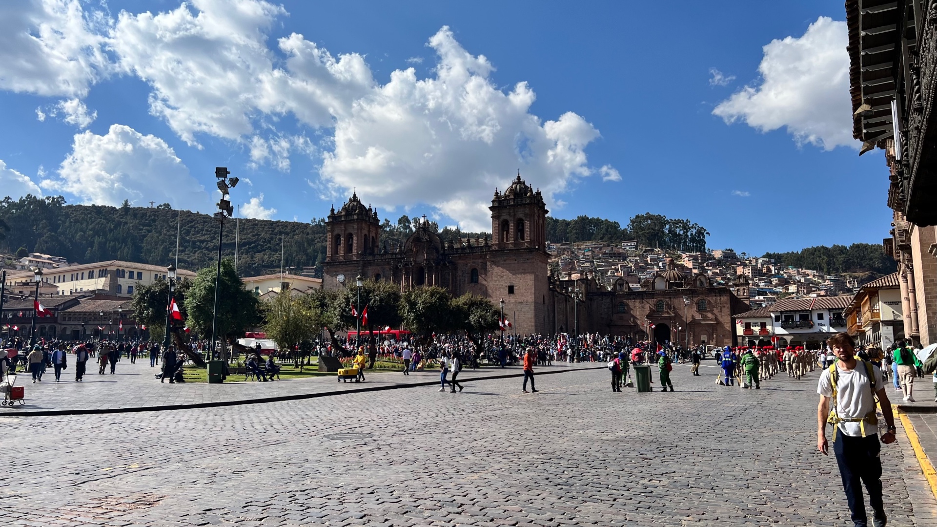 Cusco cathedral and the hillside city seen across the broad cobbled Plaza de Armas