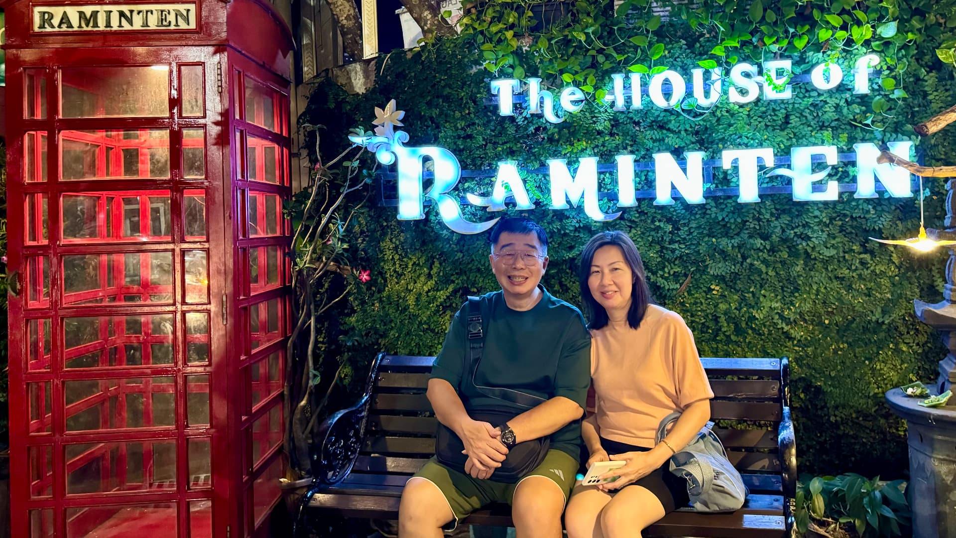 Two companions seated outside the House of Raminten