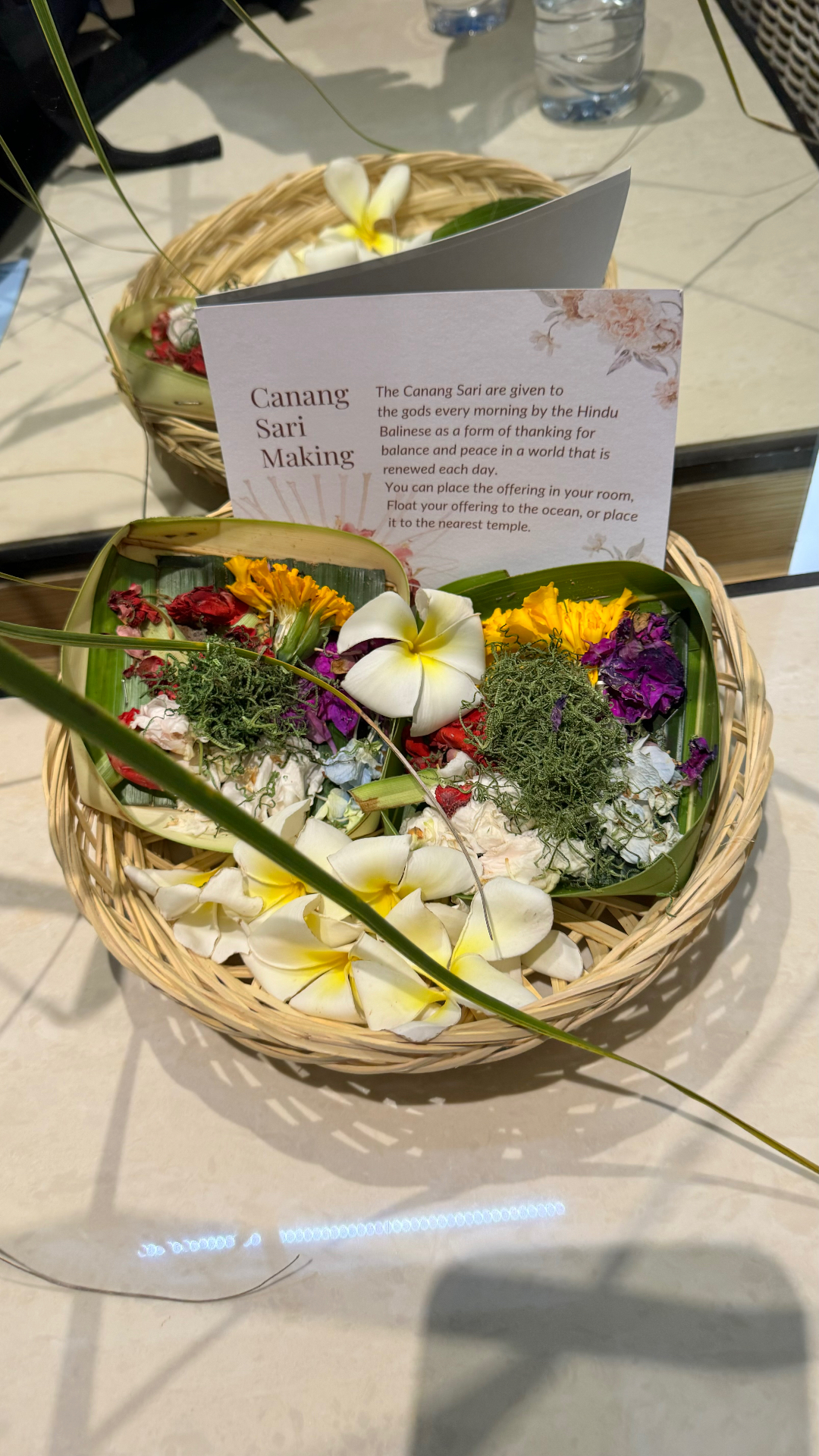 Basket of flowers and leaves prepared for making a Balinese Canang Sari offering