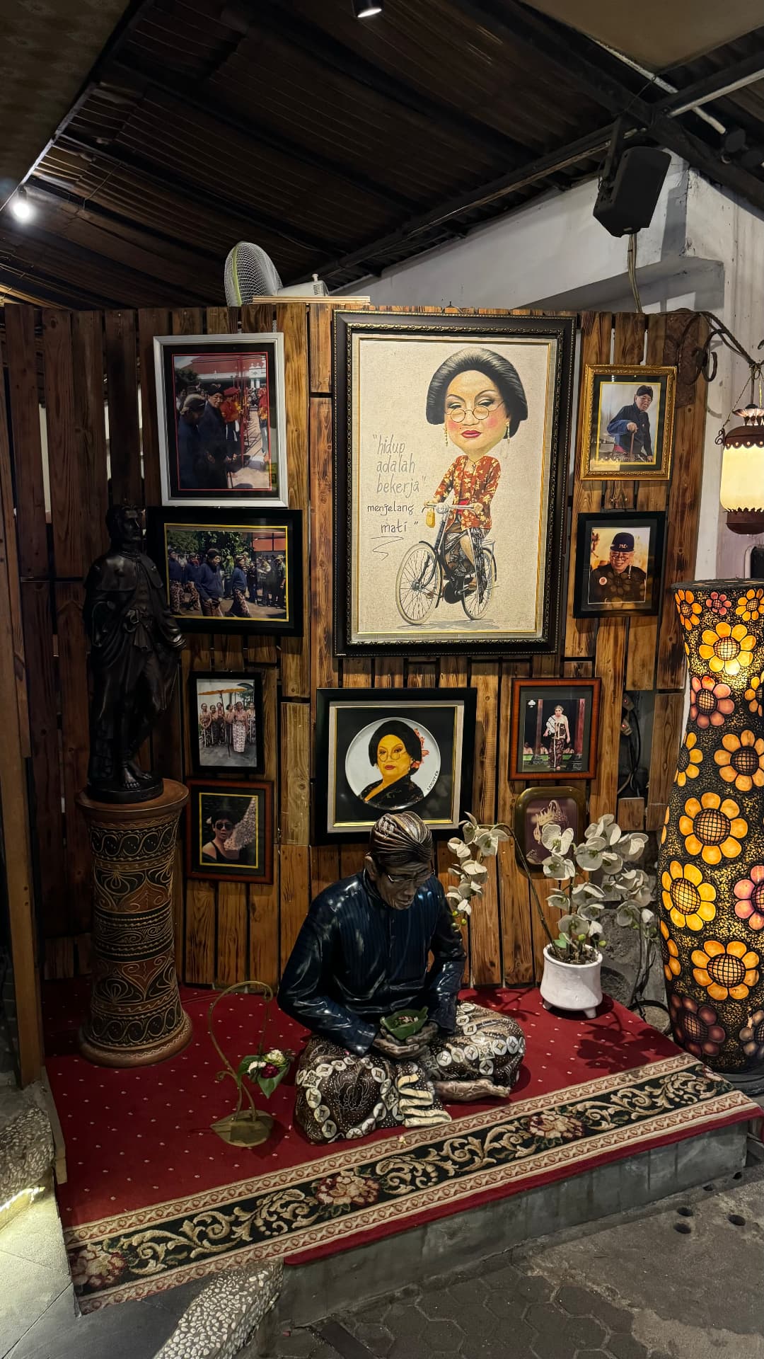 Framed portraits and sculpture at the House of Raminten