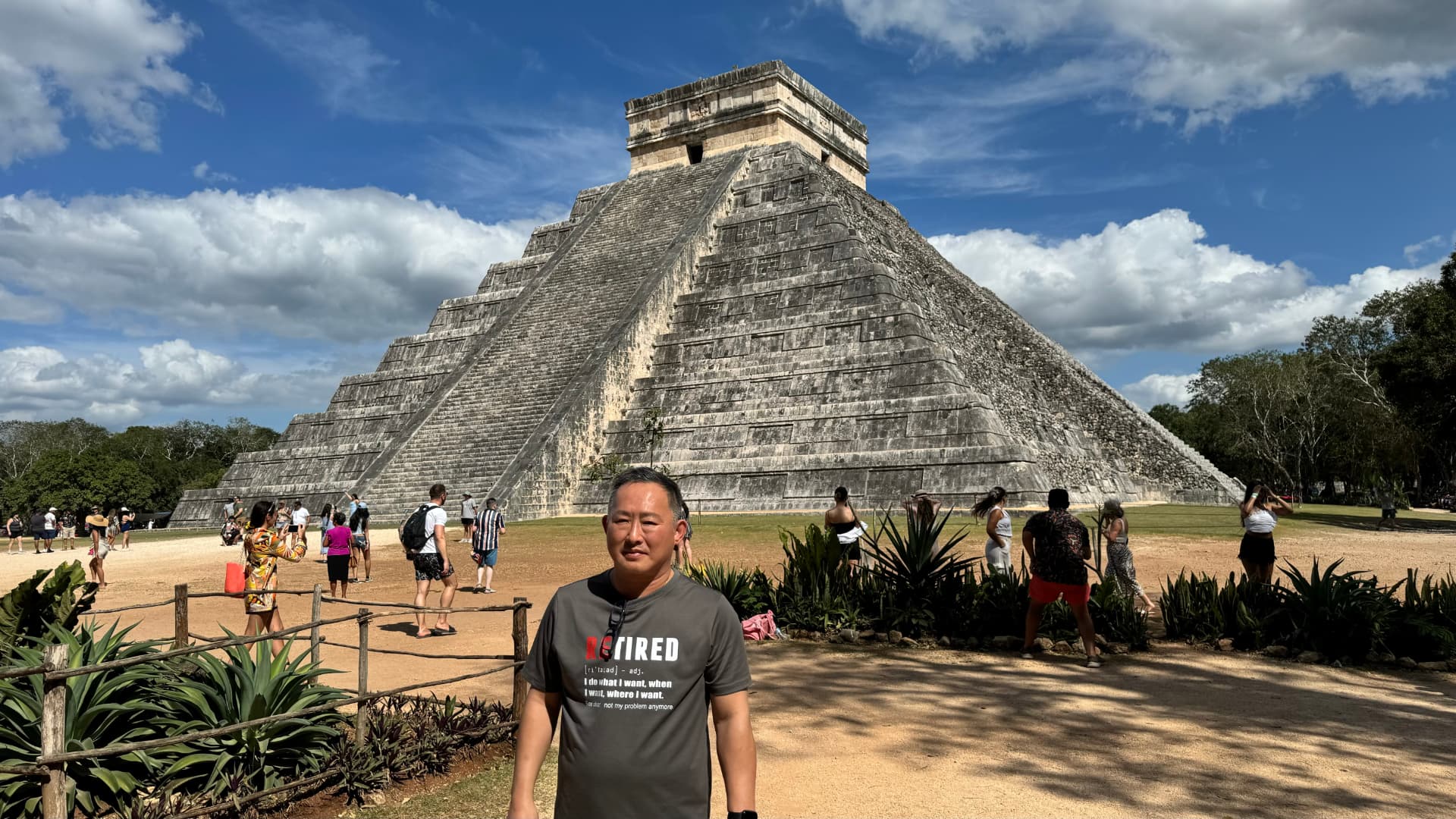 Raymond standing before El Castillo at Chichén Itzá