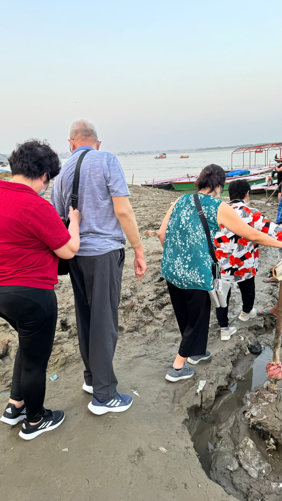 Our group makes its way toward the boats at the water’s edge. — Varanasi, Uttar Pradesh, India.