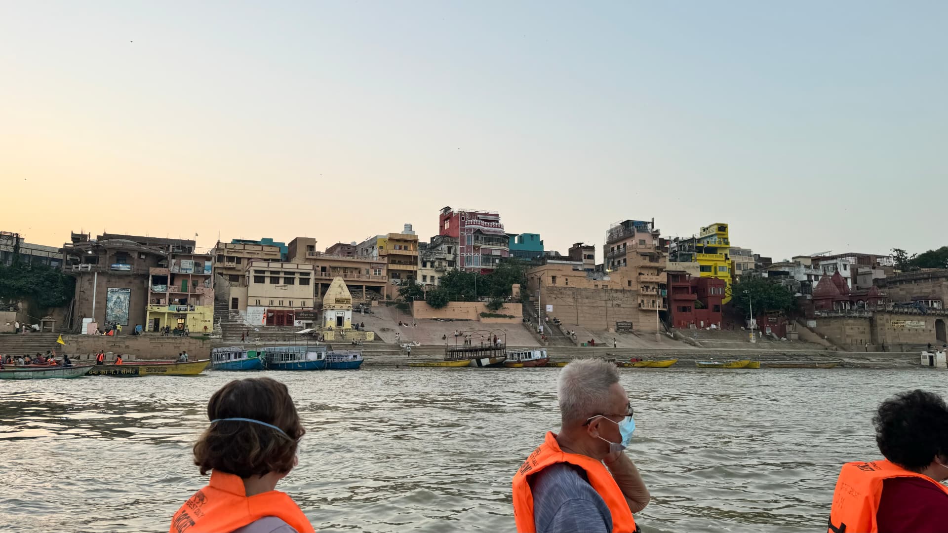 Life jackets and riverfront buildings during our Ganges boat ride. — Varanasi, Uttar Pradesh, India.