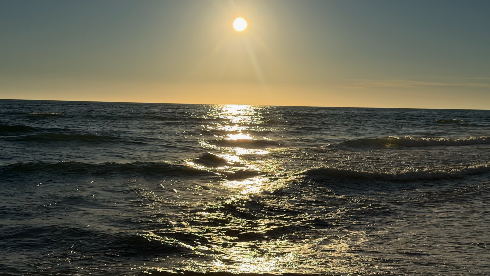 Low sun reflected across waves on the Sea of Cortez