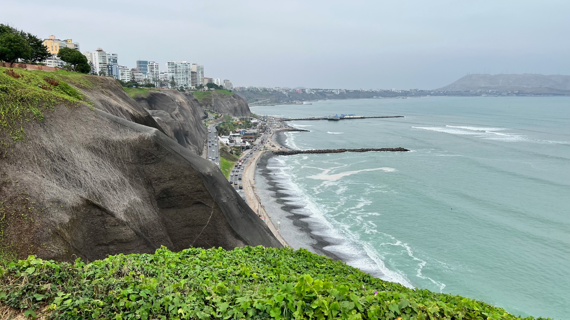 Miraflores clifftops, apartment buildings, beach, and pale Pacific water