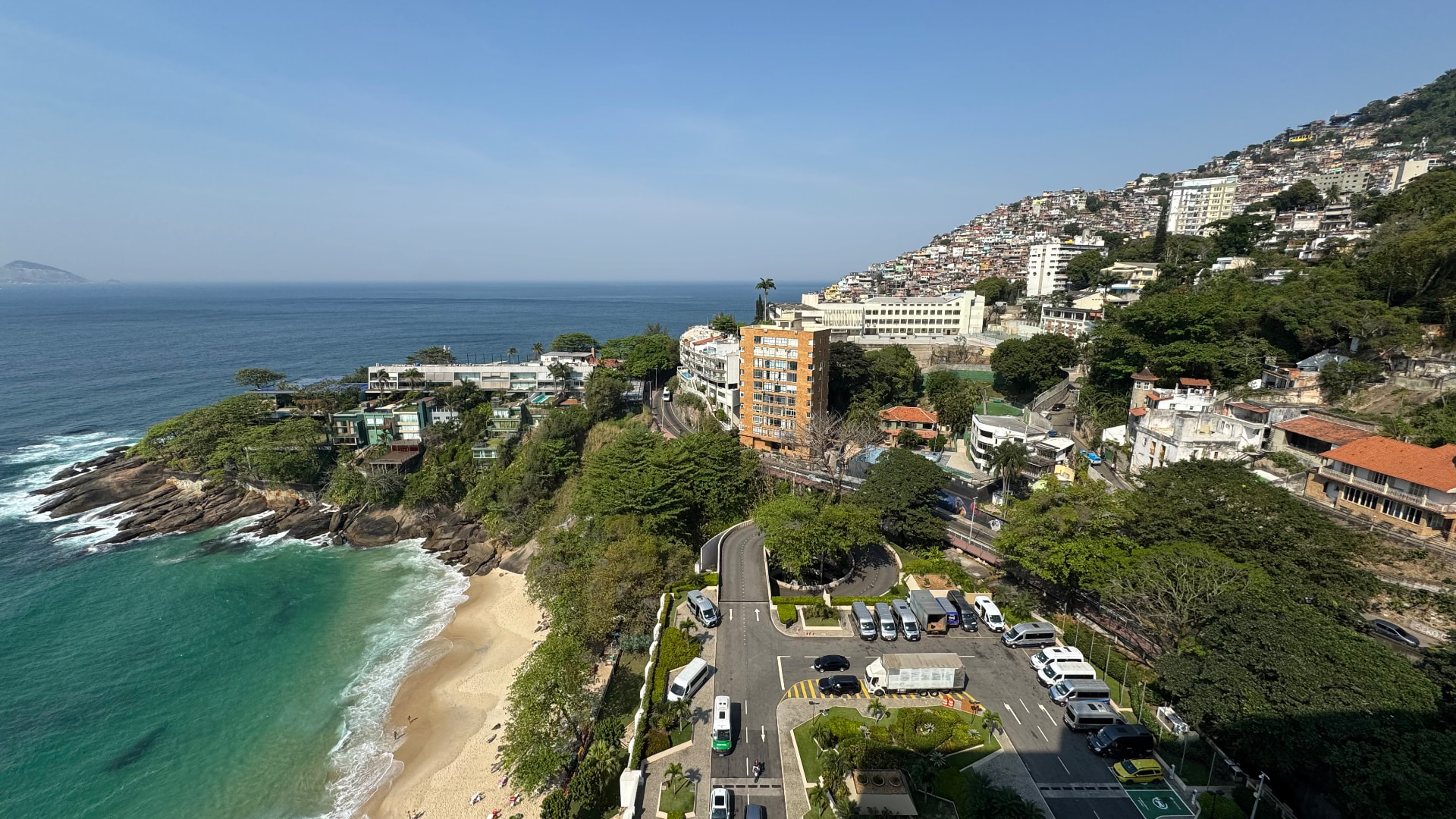 Elevated view of the coastal road, beach, and hillside homes beside the Atlantic