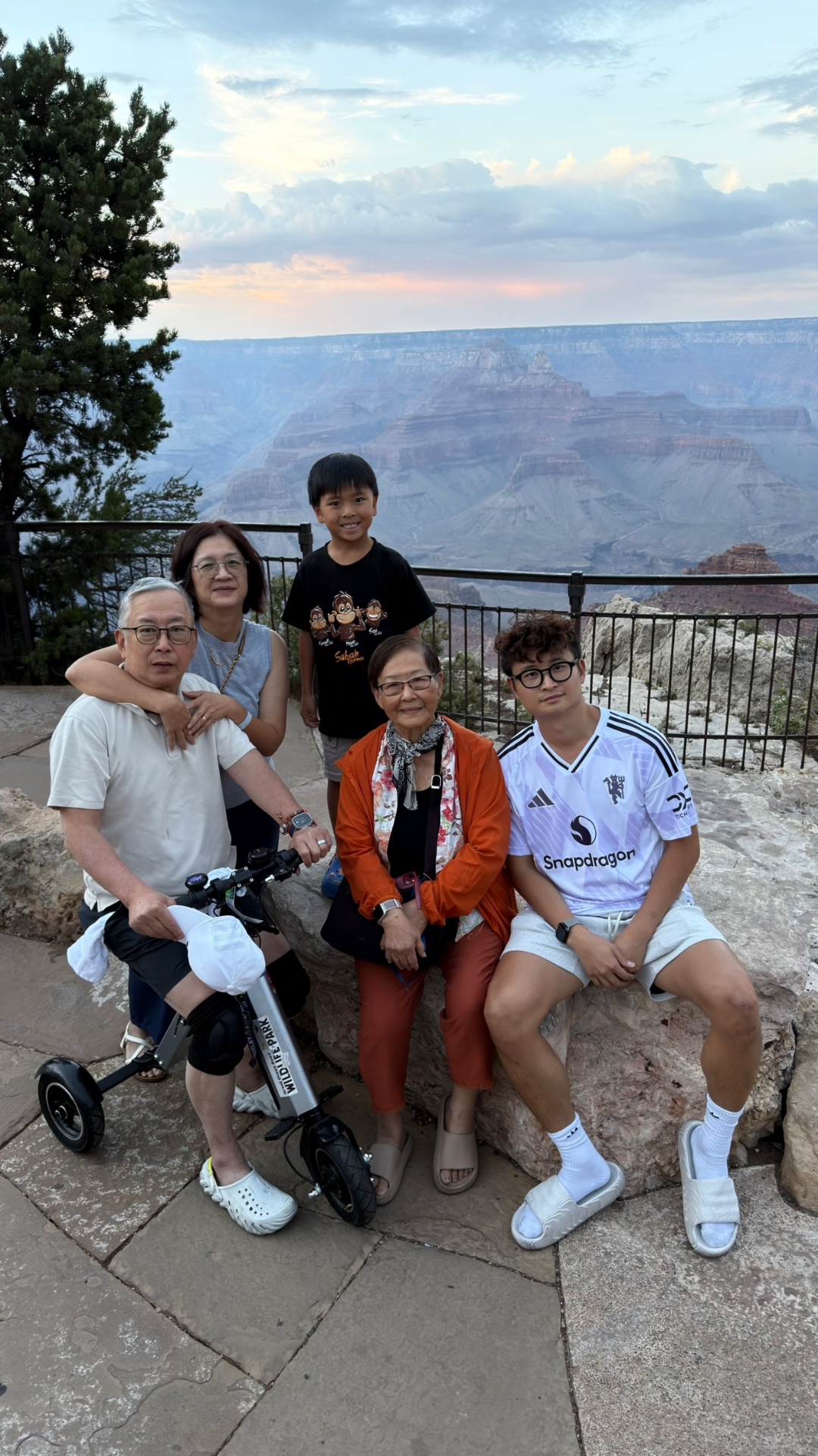 The whole family together at the canyon rim with the tricycle