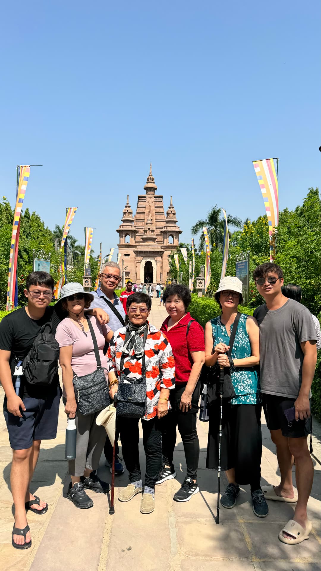 A group portrait on the approach to Mulagandha Kuti Vihar. — Sarnath, Uttar Pradesh, India.