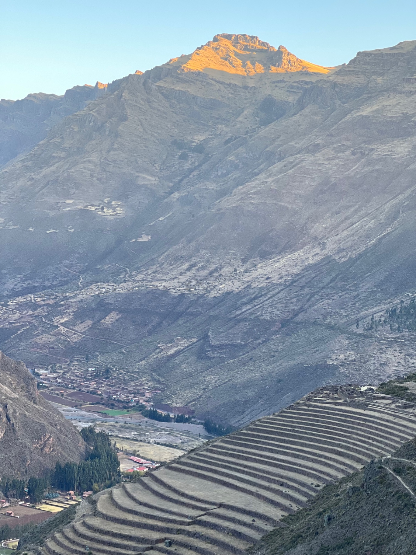 Portrait view over patterned terraces and distant mountains