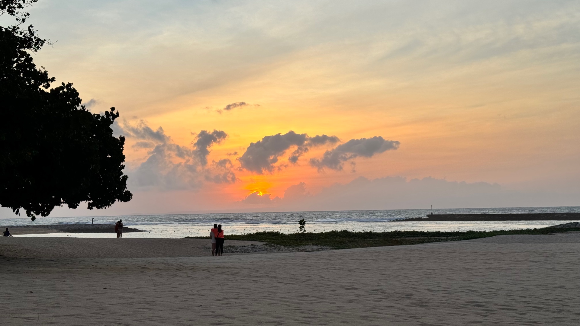 Sunset glowing orange over the beach and ocean