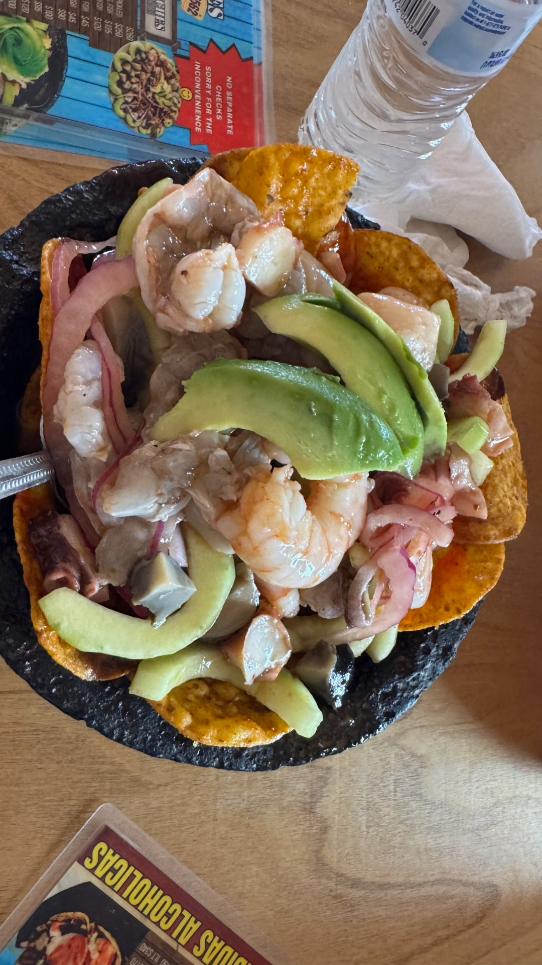 Seafood aguachile with shrimp, fish, avocado, and crisp tostadas