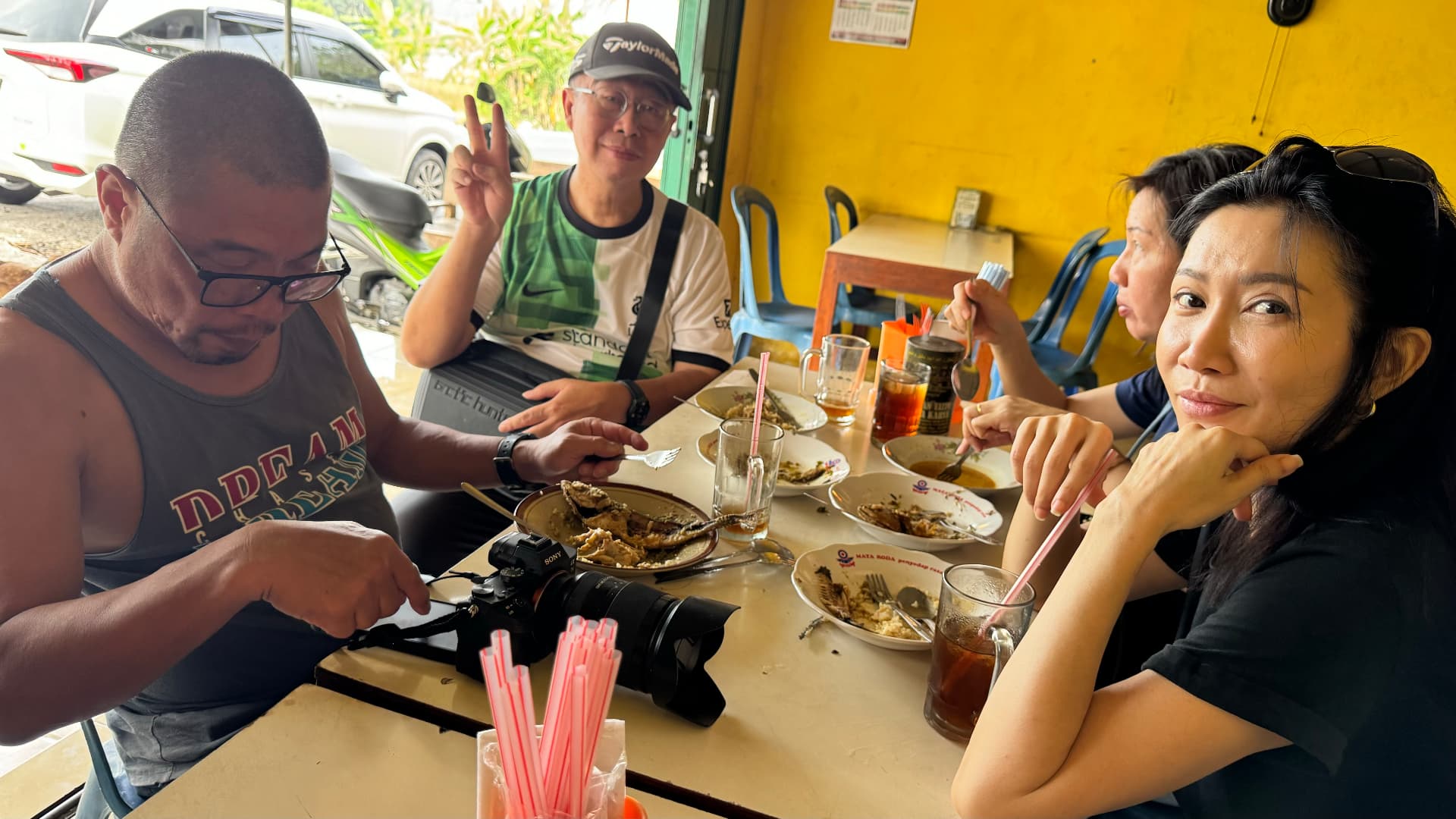 Friends gathered around a lunch table in Yogyakarta