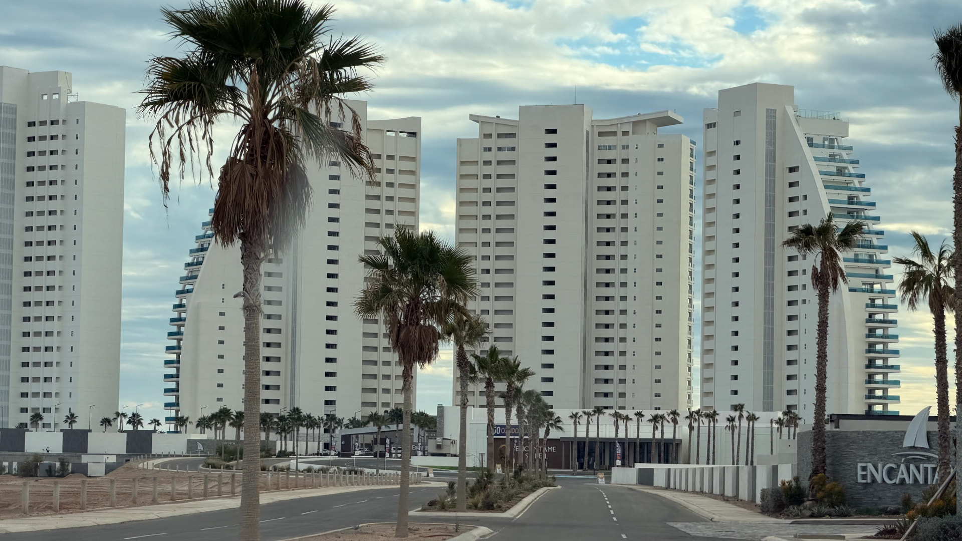 White oceanfront towers and palm trees in Puerto Peñasco