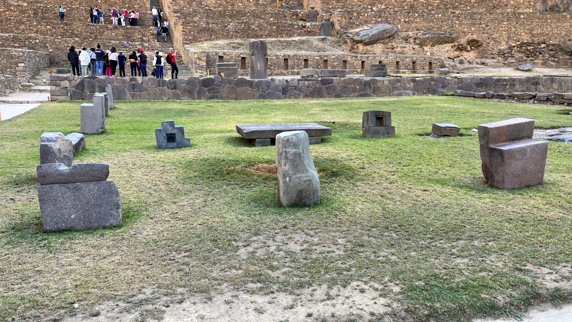 Carved stone seats arranged on the grass at Moray